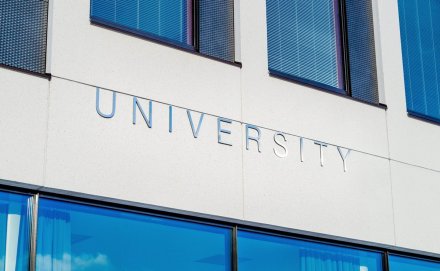 University sign on a buildings façade