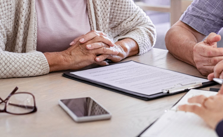 Senior couple planning their investments with financial advisor